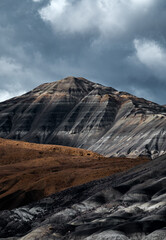 Mountains of Patagonia show texture and layers on a cloudy day with changing light