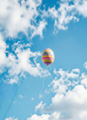 Easter egg in the form of a hot air balloon in the spring sky