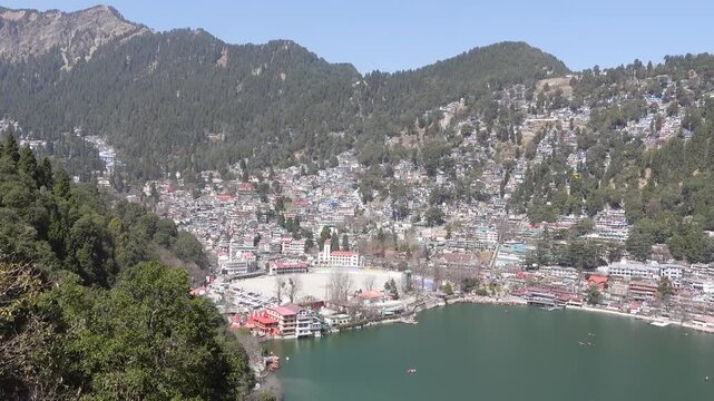 Nainital city Panoramic view in Uttarakhand surrounding the beautiful Naini Lake and Kumaon Hills.