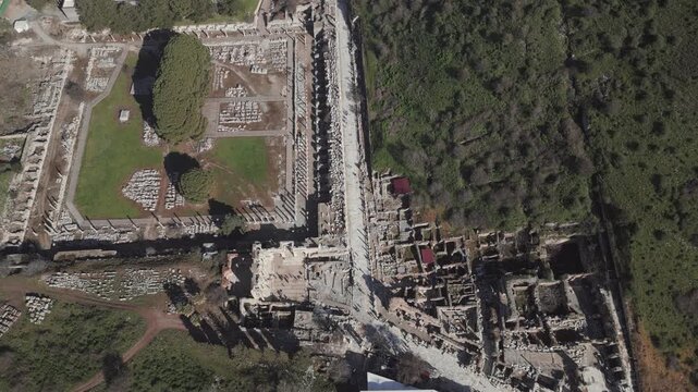 Aerial drone shot of the ancient city of Ephesus, the library of Celsus and the ancient Roman theater on a sunny day. High quality 4k footage
