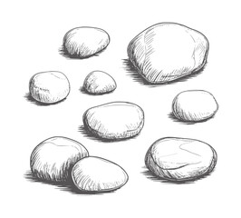 Black and white of smooth pebbles scattered a white stones