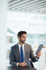 Fototapeta premium Investor, tablet and man in workplace, smile and app for trading portfolio, internet and connection. Person, financial advisor and employee in office, tech and message to contact and email for profit