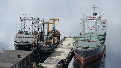 Naklejka premium Murmansk, RUSSIA - June 25, 2017: Ships in the Kola Bay. The usual daily life of the port city. Barents Sea, Gulf Stream.