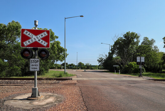 Danger or warning sign. Railway, railroad or level crossing, Australian Outback. Rural, small town living. Transportation, infrastructure and safety