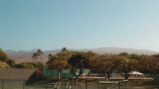Tennis Court. Mauna Kea Beach Drive, The Big Island (Hawaiʻi Island).  In the distance is Kohala mountain (Shield volcano).	