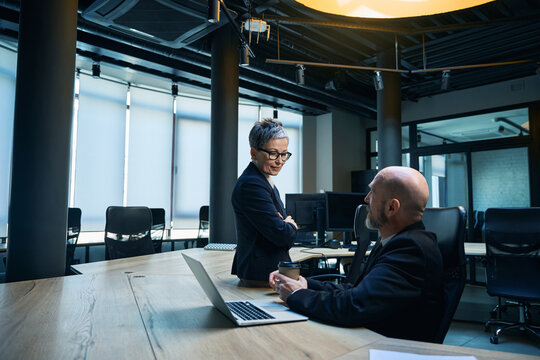 Diverse professionals collaborating in modern office boardroom
