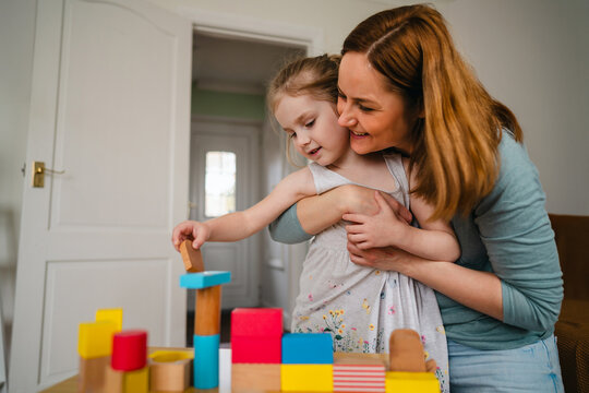 Mother and daughter having fun together at home, family time