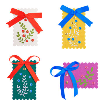 Four colorful handmade cards with ribbons and decorative colorful cards bows decorative craft