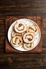Sliced diet pork roll stuffed with mushroooms, red bell pepper, spinach