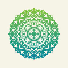 Intricately detailed mandala design featuring a gradient of green to blue.