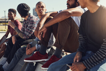 Obraz premium Skater, relax and balance with friends at park for extreme sports, training and gen z youth. Ramp, skateboard talent and hobby with group of people outdoor for culture, skating practice and fitness