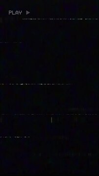 Old analog VHS playback screen showing PLAY indicator with glitch distortion and static scan lines in vertical video. Vintage tape recording interface with retro video noise.