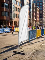 Obraz premium Blank white mockup feather flag standing city street marathon running race outdoor sports advertising event banner template design presentation