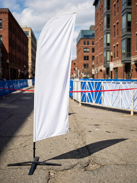 Blank white mockup feather flag standing city street marathon running race outdoor sports advertising event banner template design presentation
