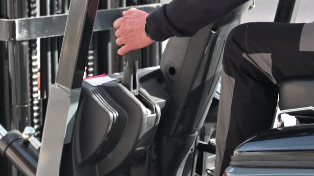 Forklift operator testing hand brake safety control before operation. High quality 4k footage