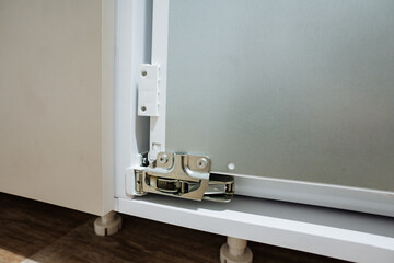 Naklejka premium Appliance Door Joints. Inspection Of Detailed Refrigerator Hinge And Mounting Hardware. Detailed Examination Of Refrigerator Door Hinge Mechanisms And Associated Installation Parts