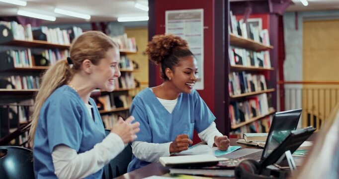 Happy women, nursing and students studying with notes and celebration in library for good results in test. Female people, medical school and victory in examination with textbook and triumph together