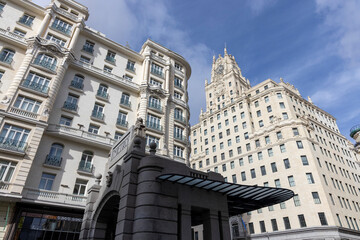 Fototapeta premium Gran via architecture, metro entrance and city buildings in madrid