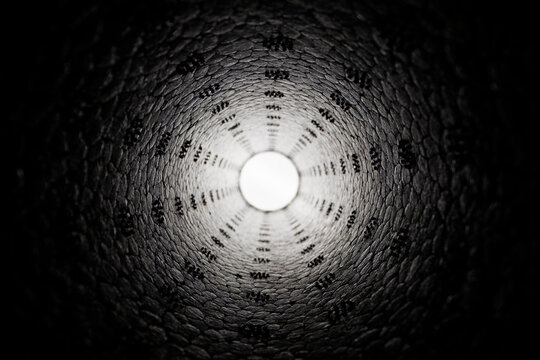 Abstract geometric texture with tunnel perspective and luminous center