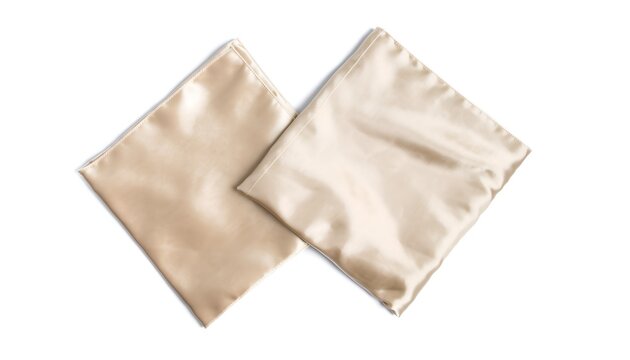 Two smooth satin pillowcases in square arrangement over white background bedding decor