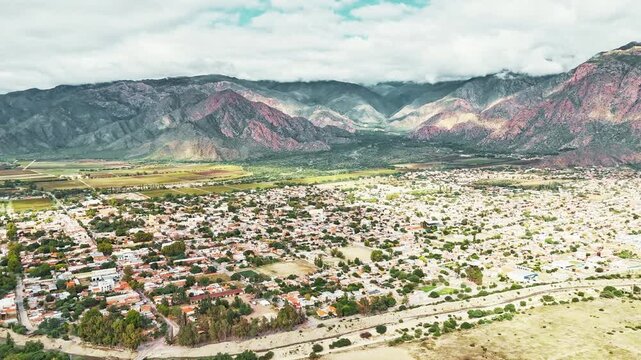 Captivating hyperlapse of Cafayate town in Salta Province Argentina on a sunny day with charming streets, colonial architecture and surrounding valley landscape cinematic 4K travel scene.
