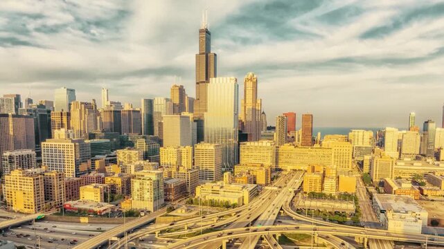 Hyperlapse from west toward Chicago skyline with busy expressway traffic flowing into downtown &ndash; dynamic urban transport scene with modern skyscrapers and evening city lights cinematic 4K.