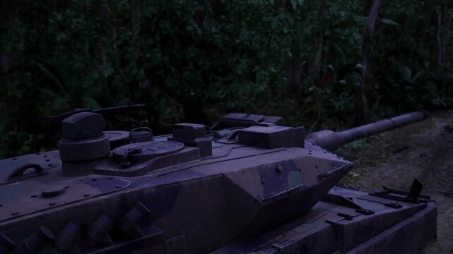 Tank hull in dark forest dusk, purple evening light casting soft shadows across camouflage panels, rainslick tracks full of mud, dormant turret and lowprofile