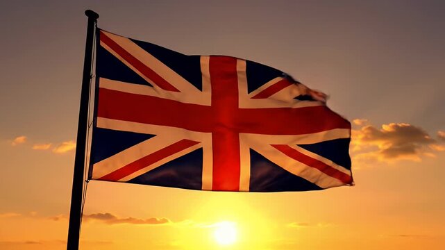 British flag waving in the wind against a golden sunset sky, patriotic symbol.