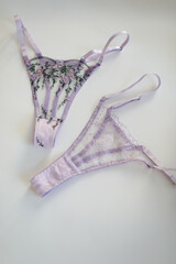 glamorous stylish sexy lace lingerie. purple lacy panties isolated over white. Shopping and fashion concept. woman accessories on white background. Top view point, flat lay. High quality photo