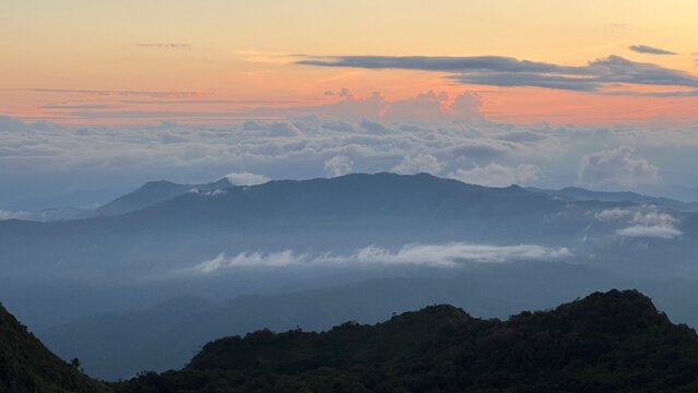 Stunning sunset view with dramatic sun rays over the Doi Luang Chiang Dao mountain range, Chiangmai, Thaiand, adventure concept.
