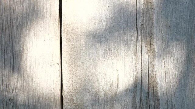 A dark vintage wallpaper featuring a rough grunge wood texture background blended with a dark gray brushed metal steel plate surface for a rustic industrial material design