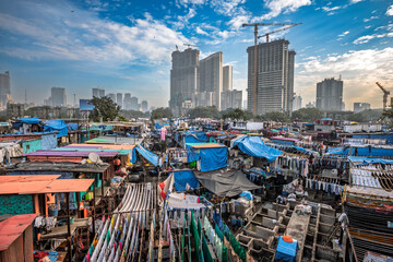 Contrast of Mumbai skyscrapers and Dhobi Ghat laundry.