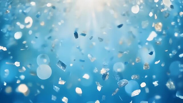 Underwater view of floating plastic debris in ocean water.