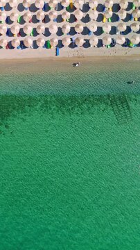 Aerial top down View of Pachia Ammos Beach with Sun Umbrellas Samothraki Greece