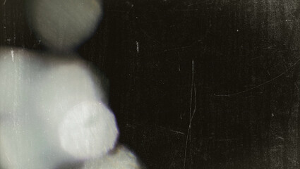 Soft light leak overlay with vintage film grain texture, Noisy film distressed bokeh flare effect,...