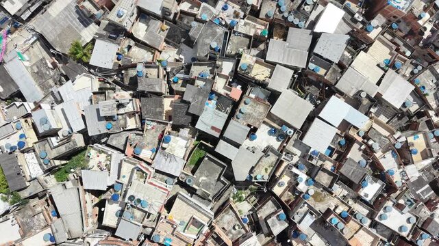 Aerial drone view of Favela Of Cantagalo, Rocinha favelas spread out on the mountain in Sao Conrado , Rio de Janeiro, Brazil.