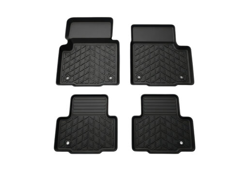 four brand new heavy-duty black rubber car mats set with textured non-slip grooves, isolated on a transparent background, top-down product shot. concept for automotive care accessory