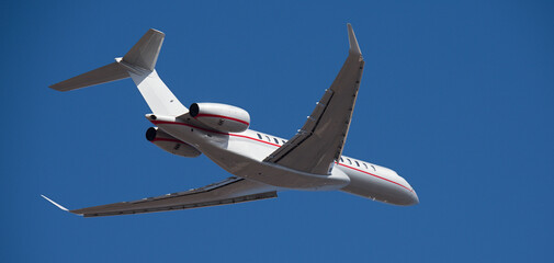Small business jet, an airplane taking off in the air. Private jet