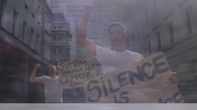 Diverse group of angry activists holding cardboard banners while giving slogans in protest march