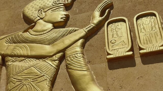 Close Up of Golden Full Scale Replica Ancient Egyptian Goddess Figurine with Cartouche Tablets