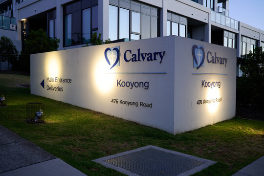Illuminated signage outside Catholic operated Calvary Health Care Bethlehem hospital, during the early evening