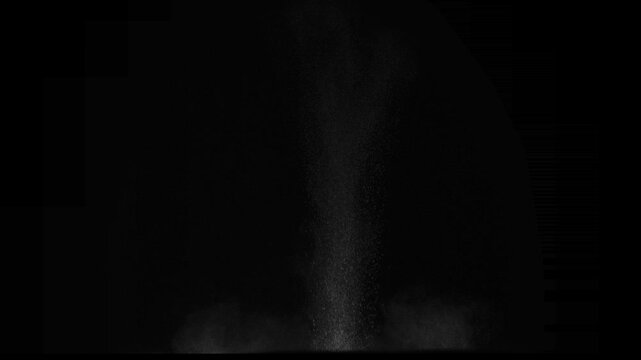 Explosion with Fire and Snow Scattering. A column of soil and dust rises into the air from the explosion. Isolated on black. Use in blend modes to simulate a battlefield