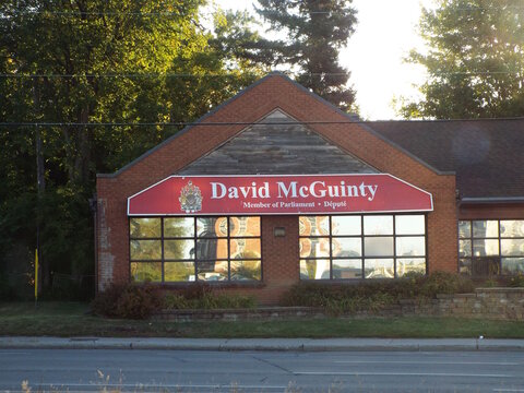 Ottawa, Ontario, Canada-July 18, 2025: The constituency office of "David McGuinty", Member of Parliament, features prominent red and white signage at 1883 Bank St.
