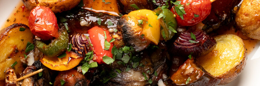 Sizzling medley of roasted veggies, vibrant harvest bounty, perfect for Autumn Equinox feasting, rich umami symphony of flavors