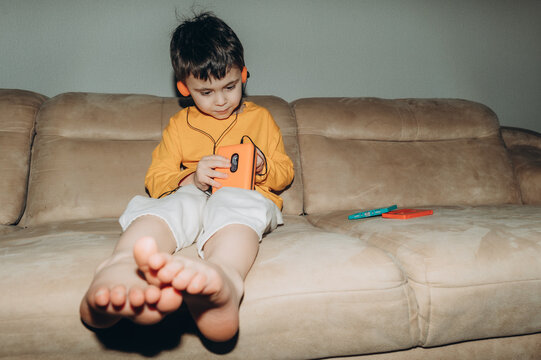 the child listens to audio cassettes using an audio player