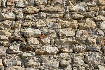 Fototapeta premium Rustic stone masonry wall texture close up background