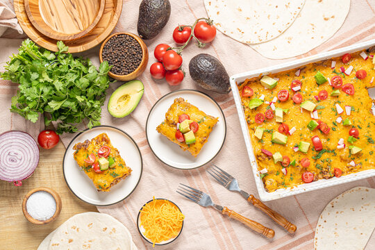 Mexican food lasagna with gorund beef, cheese, tortilla, and avocado