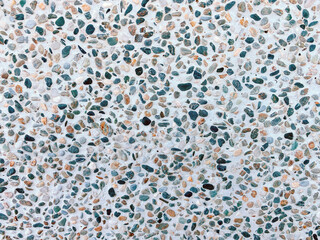 Fototapeta premium Close-up of a wall covered in various pebbles