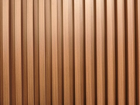 Closeup of vertical light brown wooden slat wall panels with subtle grain detail and evenly spaced shadows, creating a rhythmic linear pattern.