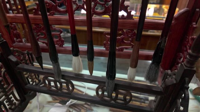 Display of multiple writing brushes on a brush rack